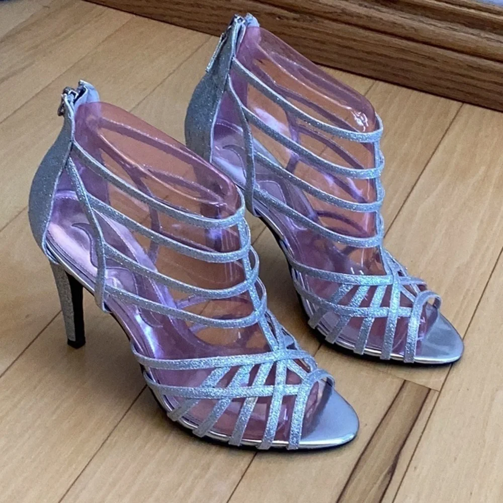 Nina silver glittery, strappy high heels, zipper to back. Women’s size 7